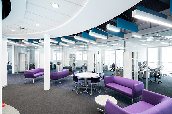 a room filled with furniture and a purple chair