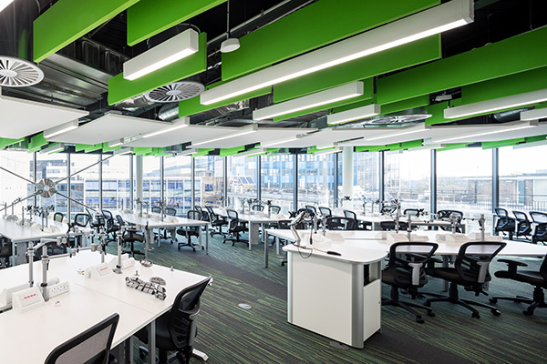 a group of people sitting at a train station
