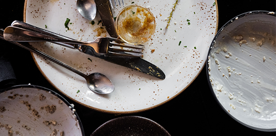 Empty plates with food scraps