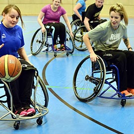 a group of people riding on the back of a bicycle