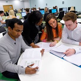 a group of people sitting at a table