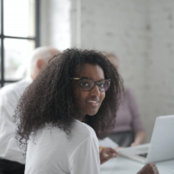 woman in glasses smiling