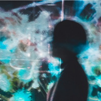 Image of person in silhouette with abstract background.