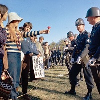 Image of peaceful protesters having a standoff with police