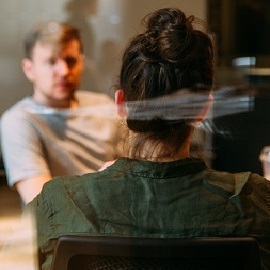 Female and male talking seriously