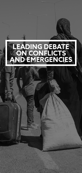 a person standing next to a suitcase