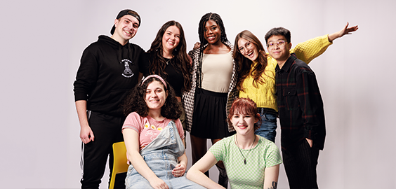 group of students smiling in a photoshoot