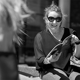 a man and a woman talking on a cell phone