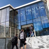 a group of people standing in front of a building