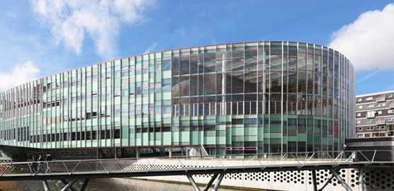 a train is parked on the side of a building