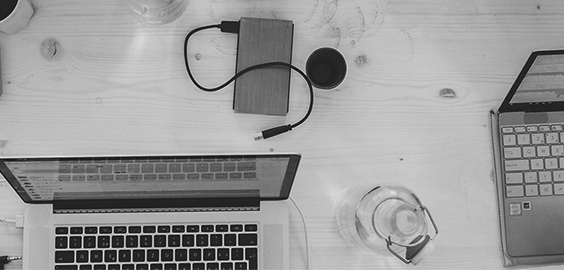a laptop computer sitting on top of a desk