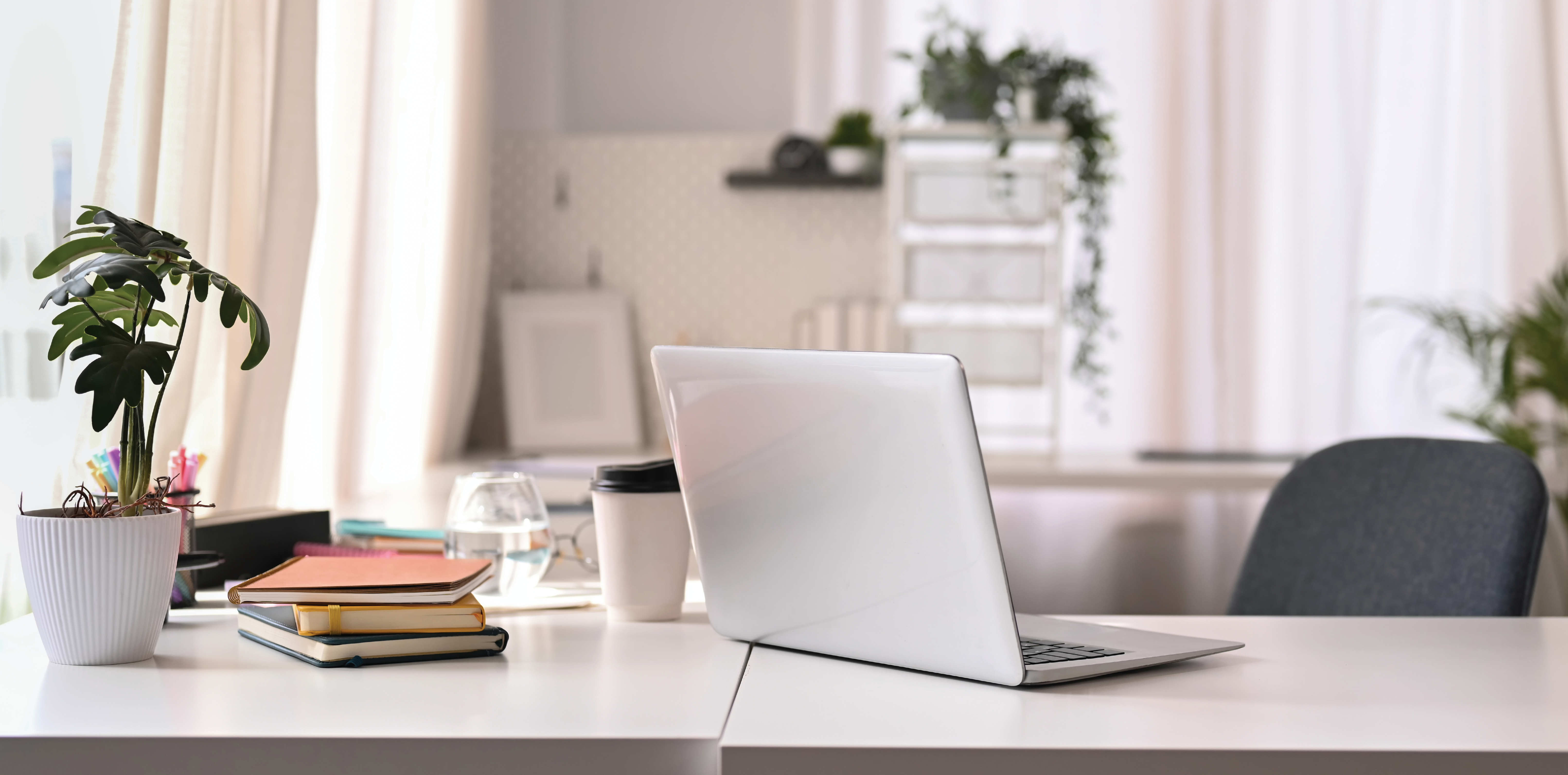 Laptop on desk with other items