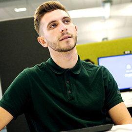 a man sitting in front of a computer