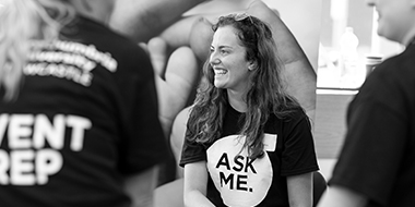 a group of people around each other