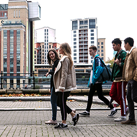 a group of people walking down the street