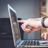 a person using a laptop computer