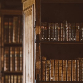 a book sitting on top of a wooden door