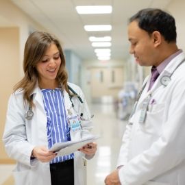 a group of people standing in a room