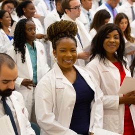 a group of people standing in front of a crowd