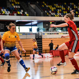 a group of people playing a game of football