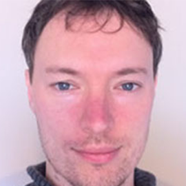 Image of teaching staff Dr Cormac Power smiling