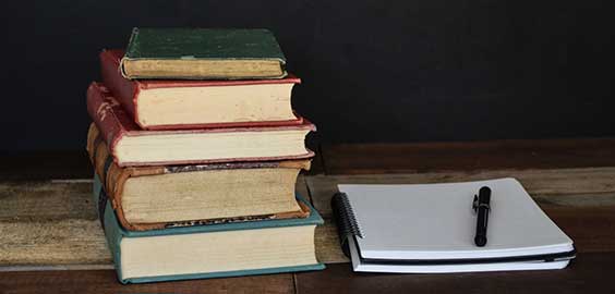 a stack of flyers on a table