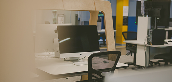 a desktop computer sitting on top of a chair