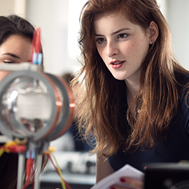 a woman looking at a laptop