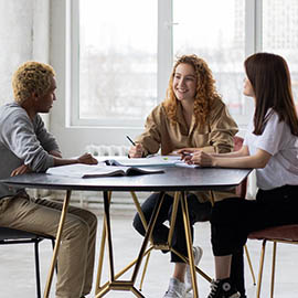 students sat around table