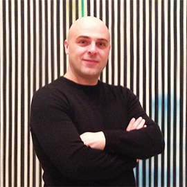 Academic staff Marco Mason with his arms crossed