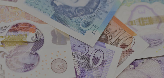 Image of various pound notes laid out on top of each other
