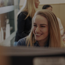 Image of smiling female postgraduate student