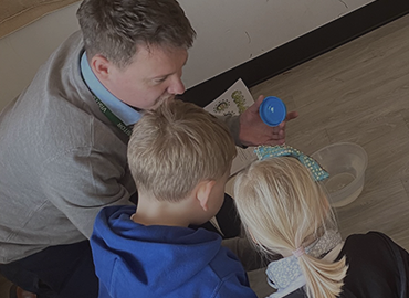 Alumni ryan teaching kids 