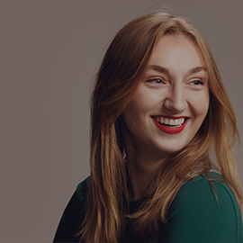 Student smiling away from camera